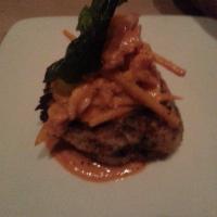 River Boat Crab Cakes · Twin crab cakes served over rice and topped with a white wine - caper - tomato - shrimp sauc...