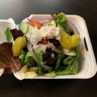 Greek Salad · Greens, tomato, cucumber, red onions,peppers,  pepperocini, Kalamata olives and feta.