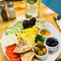 Mediterranean Breakfast · Scramble Eggs Cooked with Shiitake Mushrooms and Red Onions, Served With Side of Hummus, Ass...