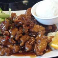 General Tso's Chicken · Lightly deep fried dark or white meat with brown garlic sauce, chili pepper, and steamed bro...