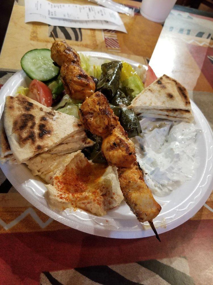 Mediterranean Platter · Our House Specialty - Healthy, Fresh & Authentic!
Fresh Greek salad, hummus, stuffed grape leaves, cucumber sauce, grilled Grecian pita, and choice of kabobs. You can order this platter with 1 or 2 kabobs. You may mix or match the kabobs.