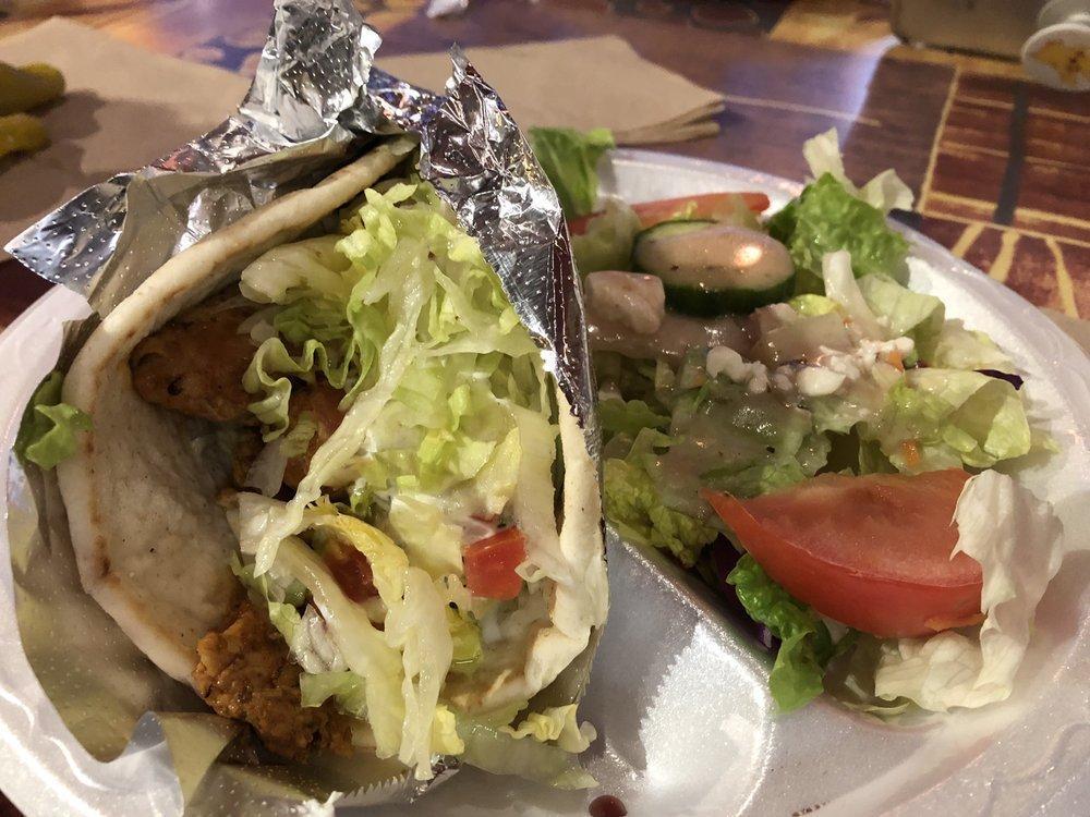 Classic Chicken Gyro · Our signature item- simply delicious and healthy!
Fresh, never frozen, chicken breast BITES marinated in our special blend of spices, grilled to order and served in warm Grecian pita with lettuce, tomatoes and cucumber sauce.