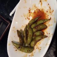 Garlic Edamame · Steamed soybeans sauteed with spicy garlic and olive oil.