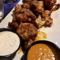 Buffalo Cauliflower · Lightly battered and fried. Served with wing sauce and ranch.