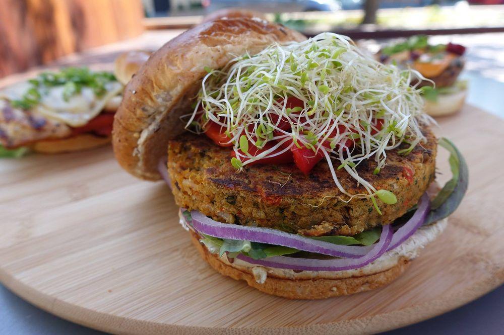 Sprouted Veggie Burger · Vegan veggie, organic mixed greens, red onions, roasted red peppers, alfalfa sprouts, Dijon balsamic and multigrain bun.