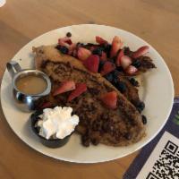 French Toast · Chocolate chips, seasonal fruit, white chocolate maple syrup. Add bacon for an additional ch...