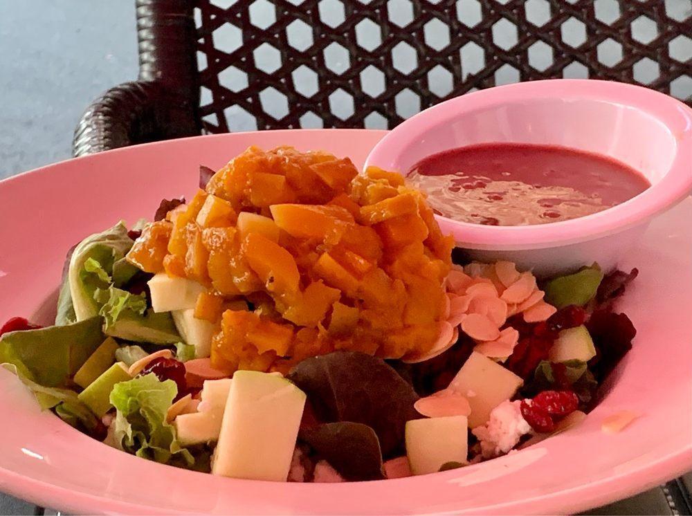 Harvest Salad · Mixed greens, sliced red apples, roasted butternut squash, goat cheese, slivered almonds and dried cranberries in a pomegranate dressing.