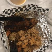Catfish Opelousas · 2 blackened fillets, topped with etouffee and fried shrimp, served with dirty rice and mixed...