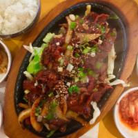 Bulgogi · Choice of marinated chicken, or pork on a sizzling cast ironskillet.