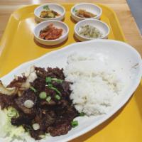 Beef Bulgogi · Thin slices of marinated beef and served on sizzling cast iron skillet.