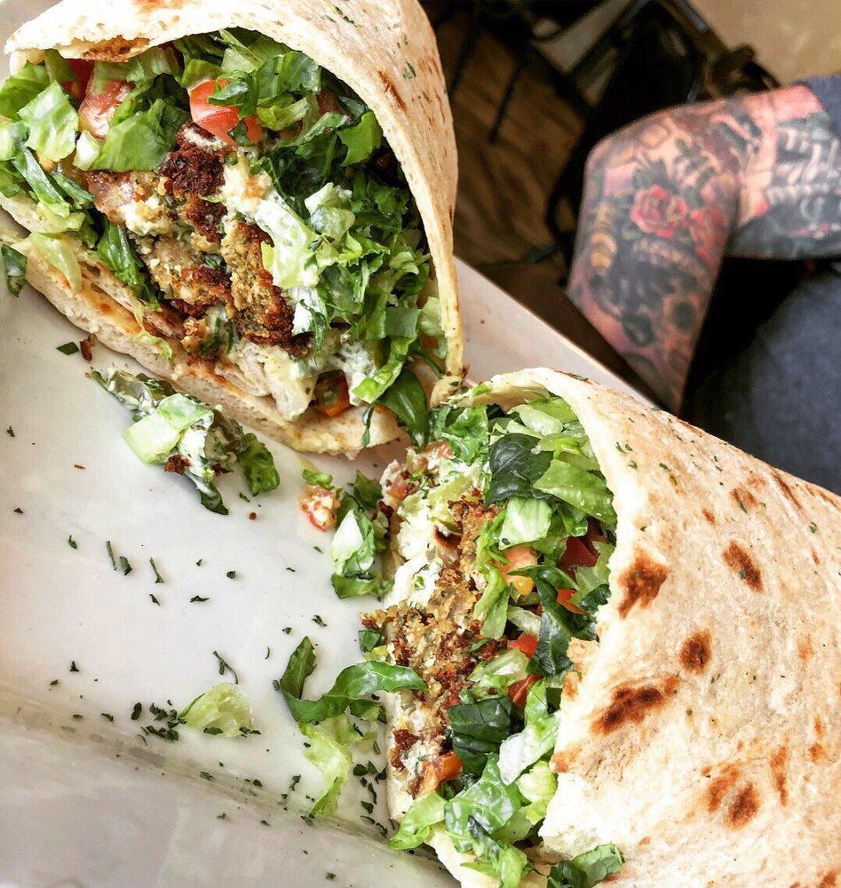 Falafel Sandwich · A healthy blend of vegetables and grains ground together and lightly fried, served with lettuce, tomatoes, diced pickles and tahini sauce wrapped saaj bread.
