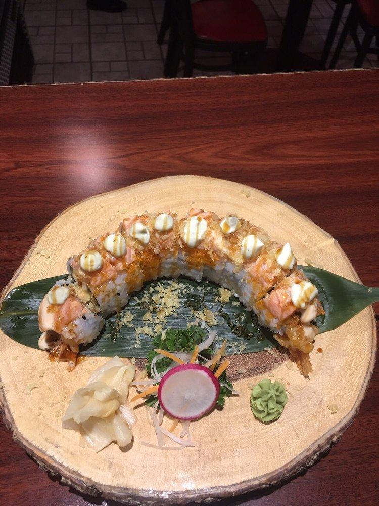 Wilton Roll · 10 cuts. Shrimp tempura, krab mix, spicy mayo, cucumber, topped with baked salmon, cilantro mayo, eel sauce and tempura flake.