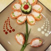 Rose Rose Roll Special · Crabmeat, avocado, sushi shrimp, wrapped with salmon, and ponzu sauce.
