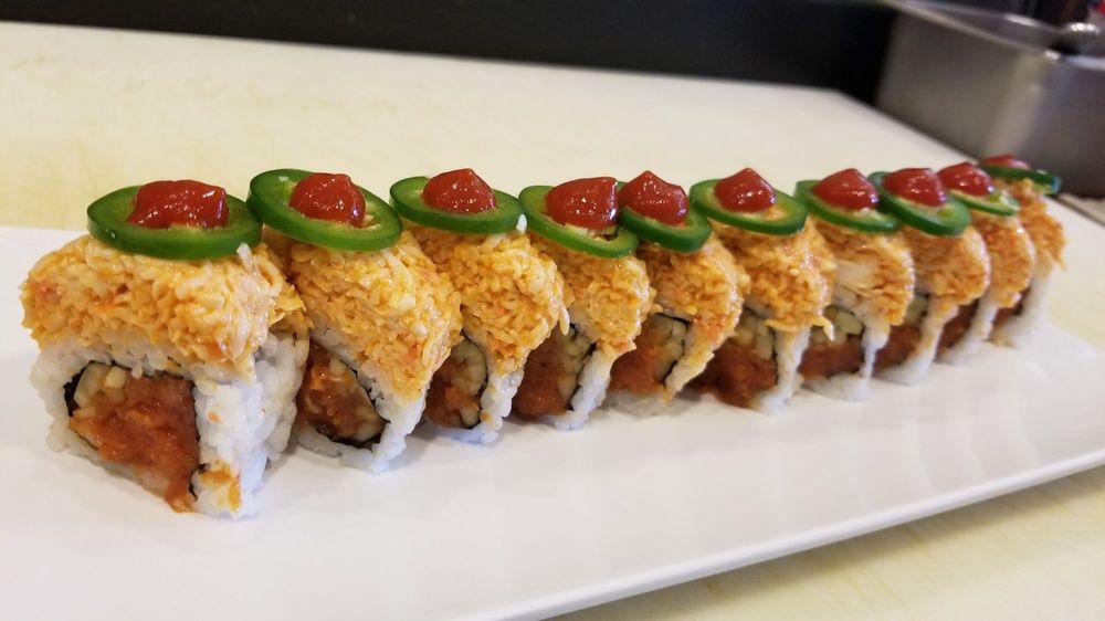 Panic Roll Special · Spicy tuna roll topped with spicy crab meat, sliced jalapeno, and hot sauce.
