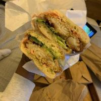 Fried Fish Sandwich · Lettuce, onion, cucumber, pickled ginger, tartar sauce, on ciabatta bread.
