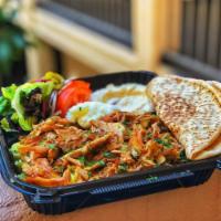 Chicken Shawarma Plate · House marinated, thinly sliced chicken breast and stacked on a standing grill and broiled to...