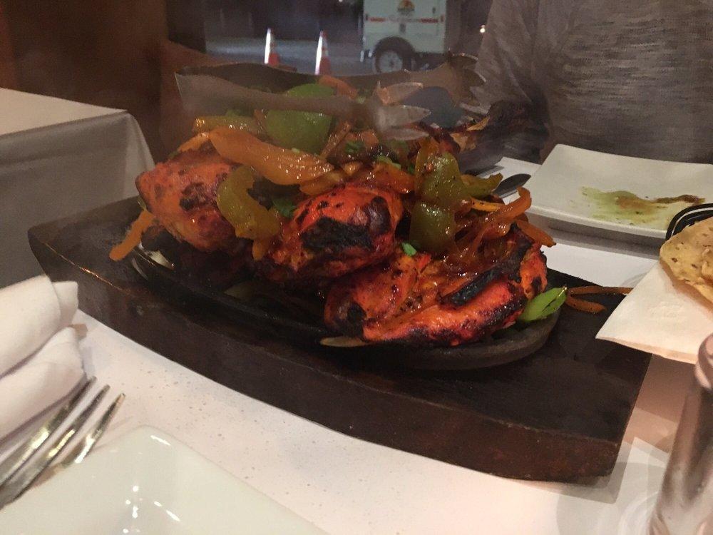 Tandoori Chicken · Chicken marinated in yogurt, ginger, and garlic, and barbecued in a clay oven.