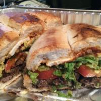 Grilled Steak Torta · Tomato, avocado, smashed beans, cheese, mayo, lettuce, chipotle or jalapenos.