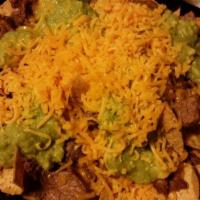 Carne Asada Chips · topped with guacamole, cheese and sour cream