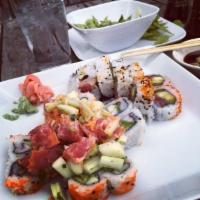 Clapton · Chopped fresh tuna, cucumber, roe, spicy mayo, scallions, on top of a California roll.