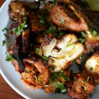 Tandoori Mixed Grill · Lamb, chicken, tikka kabab, shrimp, malai kabab, chicken tandoori.