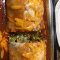 Burrito Suizo · Includes sour cream and guacamole, topped with ranchero sauce and melted cheese.