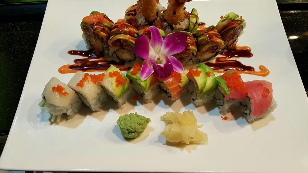 Twin Roll · Shrimp tempura inside, top with spicy tuna, avocado tobiko with spicy mayo and eel sauce.