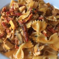 Farfalle · served with chicken, sun dried tomatoes and mushrooms in a
vodka cream sauce.