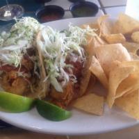 Fish Taco Especial · Fresh guacamole, cheese, cilantro and onion, our signature white sauce, mild salsa and cabba...