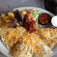 Chicken Quesadilla · Flour tortillas with cream cheese and mixed shredded cheese. Served with lettuce, salsa and ...