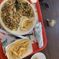 Chicken Shawarma Wrap · Lettuce, tomato, Arabic pickles, and garlic sauce.