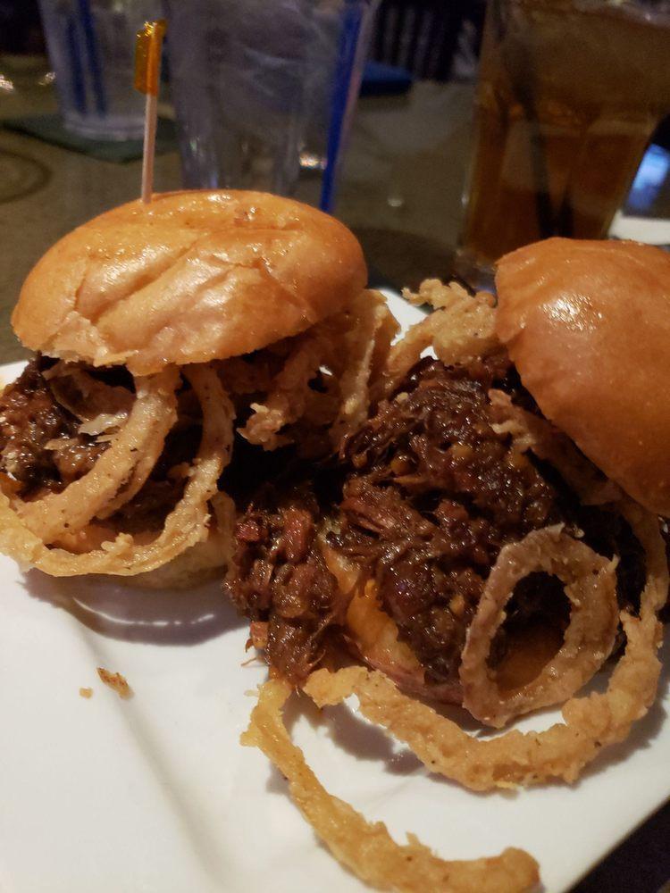 Pulled Pork Sliders · Molasses glazed pulled pork, crispy fried onions and spicy aioli served on brioche slider buns.