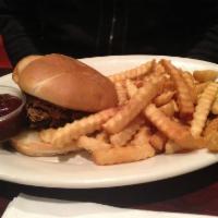 BBQ Pulled Pork Sandwich · Pulled pork smothered in BBQ and served on a pretzel bun. Served with a side order of fries,...