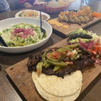 Carne Asada Plate · Flap meat, grilled onions, guacamole,  pico de gallo
