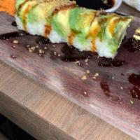 Avocado Roll · Seaweed, cream cheese, cucumber, spicy Tampico,  shrimp tempura, avocado, topped with eel sa...