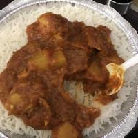 Chicken Vindaloo · Boneless chicken with potatoes in a spiced and tangy sauce. Served with cup of rice or 1 but...