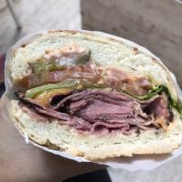 Hot Pastrami Sandwich · Pastrami brisket marinated overnight steamed in our kettle, cheddar cheese, Lou's special sa...