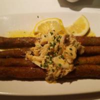 Perry's Signature Fried Asparagus · topped with blue lump crabmeat