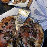 Veggie Marinara Pizza · Tomato sauce, shredded mozzarella, fire-roasted peppers, sliced red onions, sautéed mushroom...