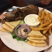 Gyro · Lamb and beef with spices, cooked rotisserie style. Served with tzatziki yogurt sauce, feta ...