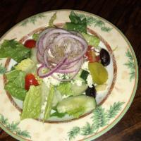 Greek Salad · Romaine lettuce tossed with Kalamata olives and imported Greek feta cheese, onions, tomatoes...