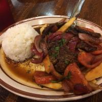 Lomo Saltado · Fresh beef sauteed in olive oil, white wine, red onions, tomatoes and fresh herbs.