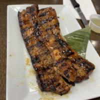 Grilled Pork Belly · Sliced bone-in pork belly marinated with our house blend spices and grilled to perfections. ...