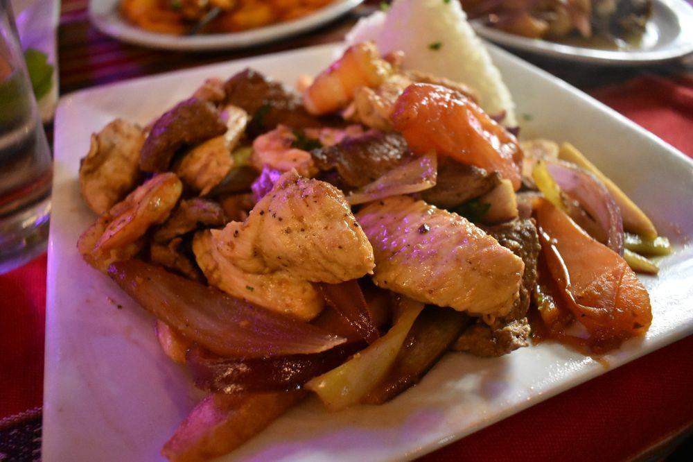 Lomo Saltado · Tender strips of chicken saltado marinated in Peruvian spices sauteed with onions, tomatoes, and parsley over a bed of potatoes. Served with jasmine rice.