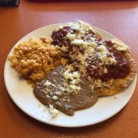 Huevos Rancheros · Two Sunny side-up eggs on fried tortillas, covered with warm salsa and your choice of two si...