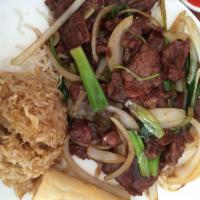 Mongolian Beef · Onion, green onion and crispy rice noodle.
