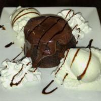 Chocolate Lava Cake · Chocolate cake with a warm flowing chocolate center. Topped with ice cream.