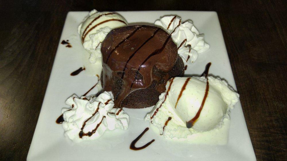 Chocolate Lava Cake · Chocolate cake with a warm flowing chocolate center. Topped with ice cream.