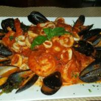 Linguini Fra Diavolo · Mussels, shrimp and calamari served over a bed of linguini.