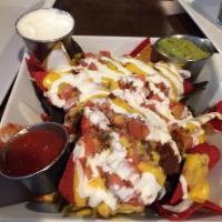 Chili · Our butcher’s blend of juicy beef, beans, and jalapeños served with melted cheddar and crisp...